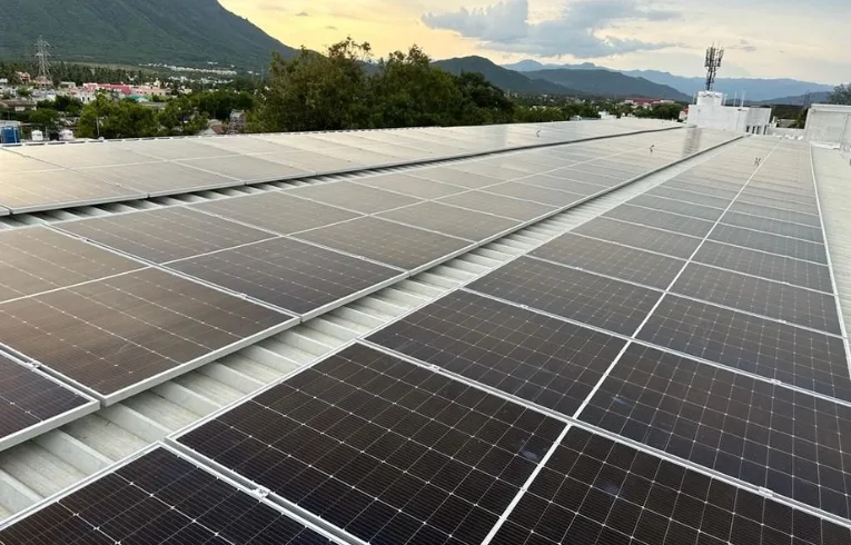 Solar panels installed across a metal rooftop